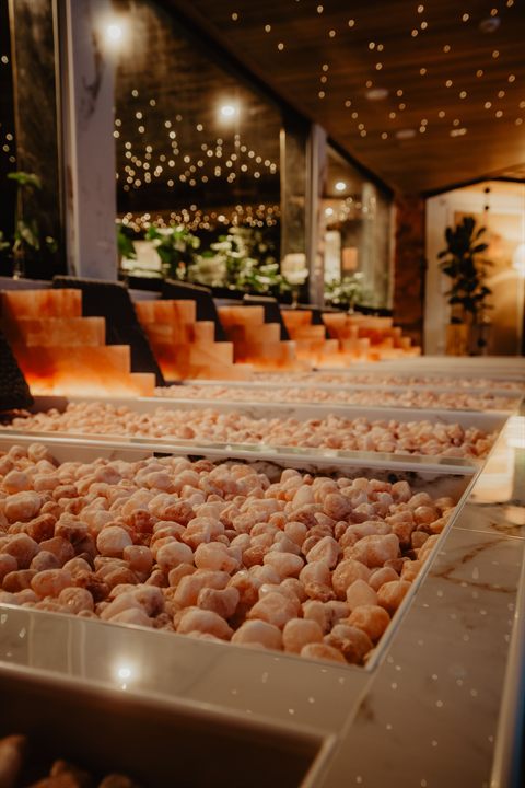 Warm Himalayan salt beds glowing in the evening spa