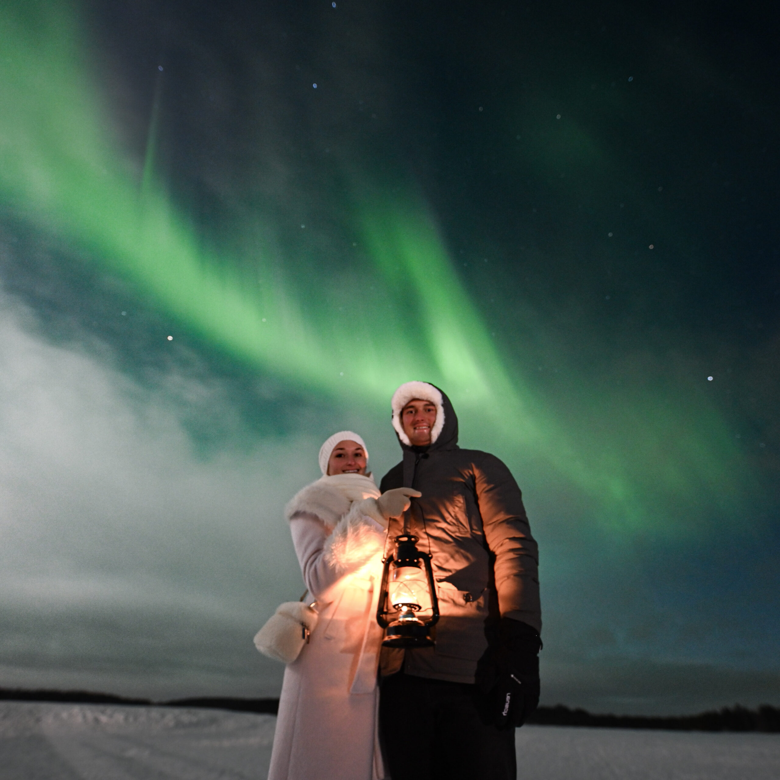 Small group enjoying the Northern Lights in Finland